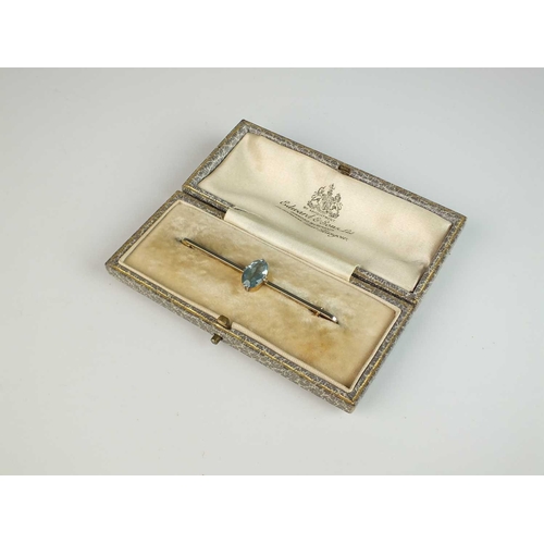 152 - An Art Deco aquamarine bar brooch, the oval mixed cut aquamarine claw set to yellow and white metal ... 