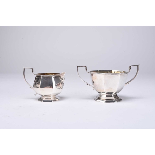 29 - An Edwardian three piece silver tea service, William Aitken, Birmingham 1905, each piece of octagona... 