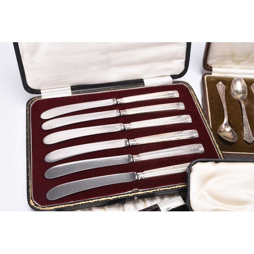 31 - A collection of loose and cased silver cutlery, comprising; a cased set of six silver handled side k... 