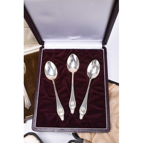 31 - A collection of loose and cased silver cutlery, comprising; a cased set of six silver handled side k... 