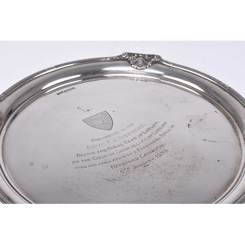 40 - A silver salver, Walker & Hall, Sheffield 1938, of circular form with reed and shell rim, the centre... 