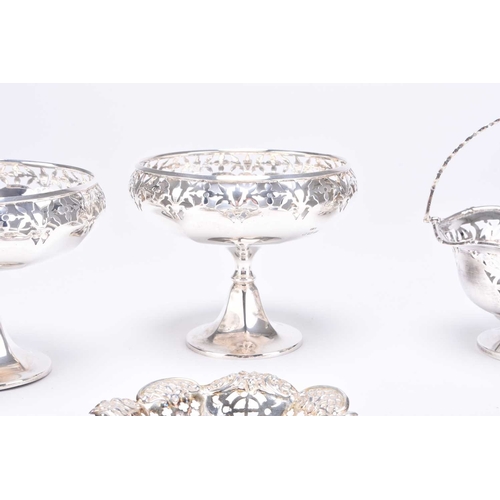 54 - A pair of pedestal silver bon bon dishes, E S Barnsley & Co, Birmingham 1921, each with decorative p... 