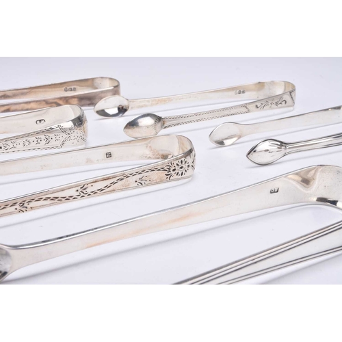 72 - A collection of eight silver sugar tongs, to include; an example by Peter & William Bateman, London ... 