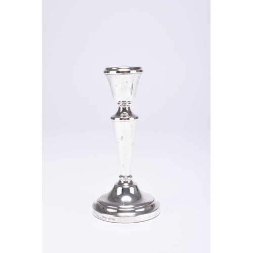 86 - A set of four silver mounted candlesticks, J M-A, Birmingham 1972, 14.5cm high, together with a pair... 