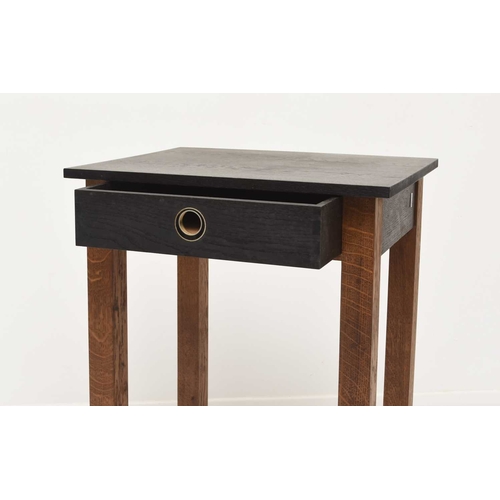 128 - Jim Sadler, Ebonised and oak side table, the rectangular top above a single frieze drawer raised on ... 