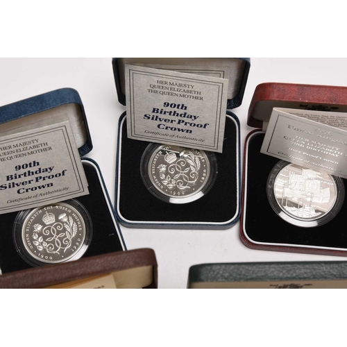 257 - A collection of coins, comprising; three silver proof five pounds commemorative coins dated 1990 x 2... 