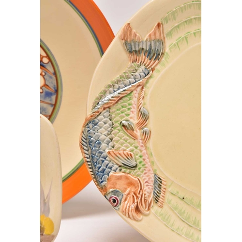 144 - A collection of Clarice Cliff Art Deco ceramics, comprising: A 'Ravel' Odilon circular tureen and co... 