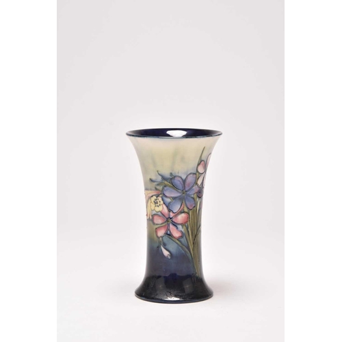 145 - A Walter Moorcroft 'Spring Flowers' trumpet vase, circa 1948, typically tubelined with the flowers a... 