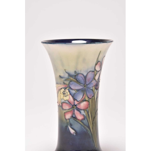 145 - A Walter Moorcroft 'Spring Flowers' trumpet vase, circa 1948, typically tubelined with the flowers a... 
