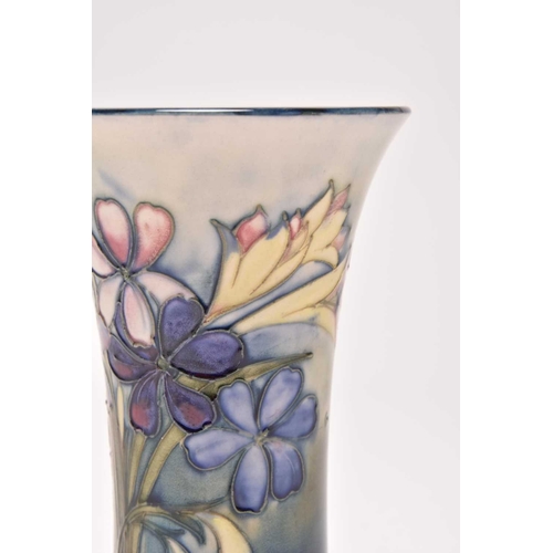 145 - A Walter Moorcroft 'Spring Flowers' trumpet vase, circa 1948, typically tubelined with the flowers a... 