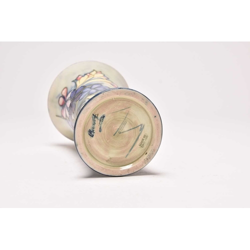 145 - A Walter Moorcroft 'Spring Flowers' trumpet vase, circa 1948, typically tubelined with the flowers a... 