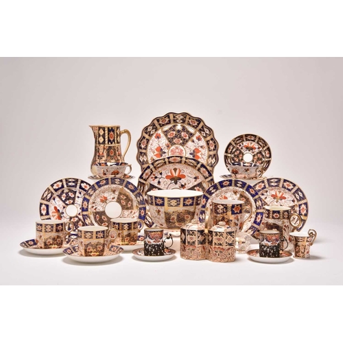 163 - A varied collection of assorted English imari tea and coffeewares, comprising a Wade double preserve... 