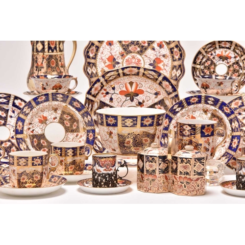 163 - A varied collection of assorted English imari tea and coffeewares, comprising a Wade double preserve... 