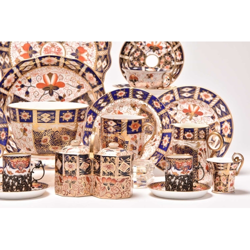 163 - A varied collection of assorted English imari tea and coffeewares, comprising a Wade double preserve... 