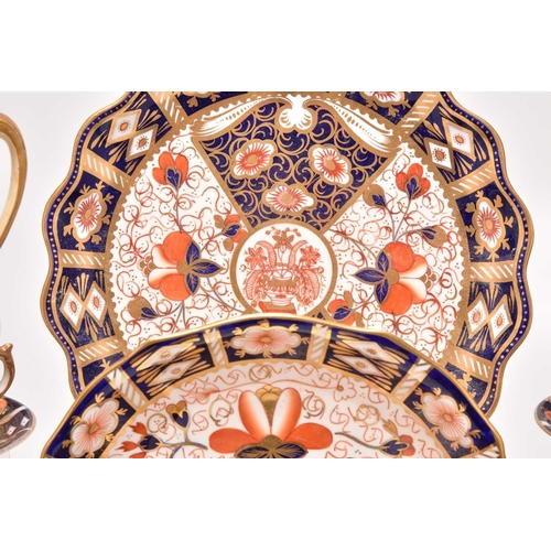 163 - A varied collection of assorted English imari tea and coffeewares, comprising a Wade double preserve... 
