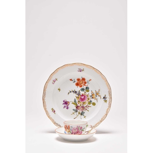 181 - A Meissen teacup and saucer, Marcolini period (1774-1814), painted with floral bouquets in colourful... 