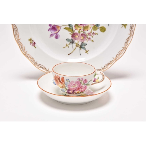 181 - A Meissen teacup and saucer, Marcolini period (1774-1814), painted with floral bouquets in colourful... 