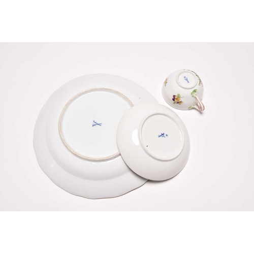 181 - A Meissen teacup and saucer, Marcolini period (1774-1814), painted with floral bouquets in colourful... 