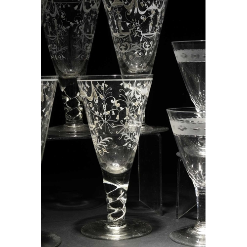 188 - A set of six goblets, 20th century, decorated in white enamel with ribbons, vases, angel's heads and... 
