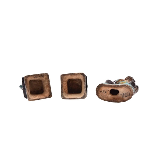 199 - A fahua-glazed figure of a scholar and a pair of Buddhist lions Ming Dynasty The scholar modelled se... 