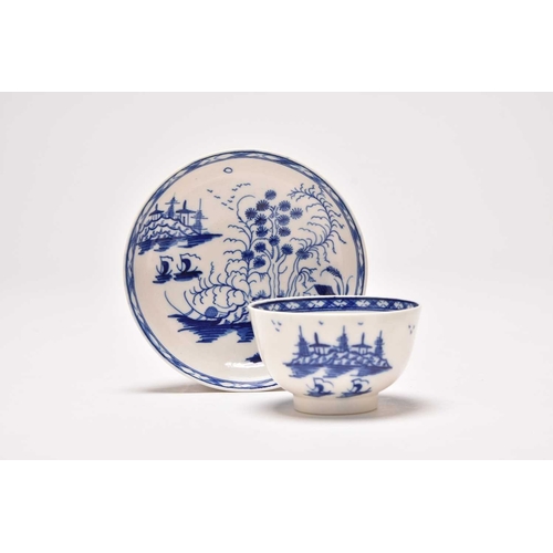 23 - An uncommon Caughley 'Rock Strata Island' tea bowl and saucer, circa 1776-90, painted in underglaze ... 