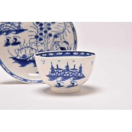 23 - An uncommon Caughley 'Rock Strata Island' tea bowl and saucer, circa 1776-90, painted in underglaze ... 