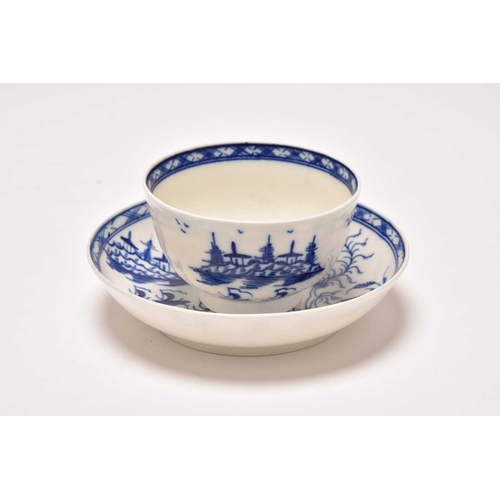 23 - An uncommon Caughley 'Rock Strata Island' tea bowl and saucer, circa 1776-90, painted in underglaze ... 