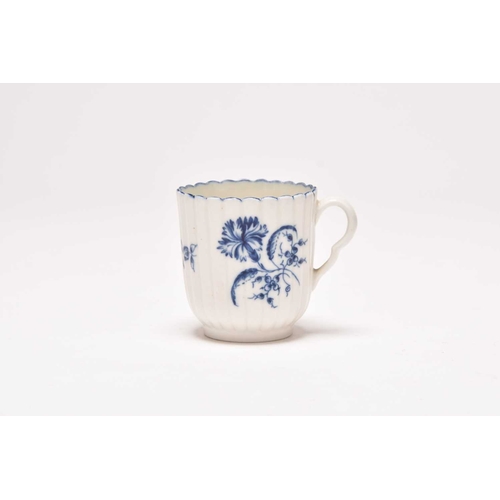 63 - A Caughley 'Gillyflower' coffee cup, circa 1775-80, of vertical reeded form, painted in underglaze b... 