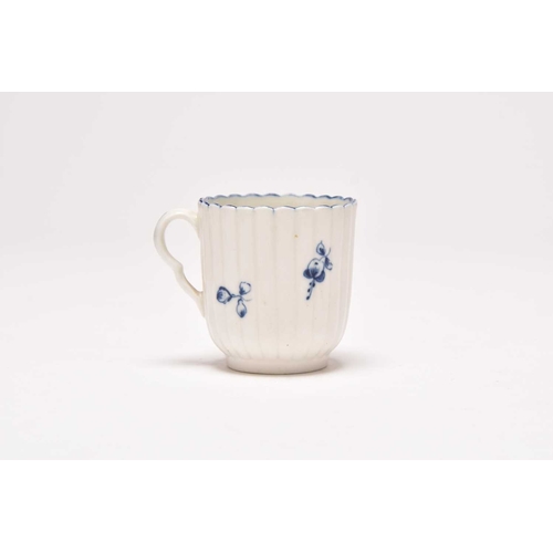 63 - A Caughley 'Gillyflower' coffee cup, circa 1775-80, of vertical reeded form, painted in underglaze b... 