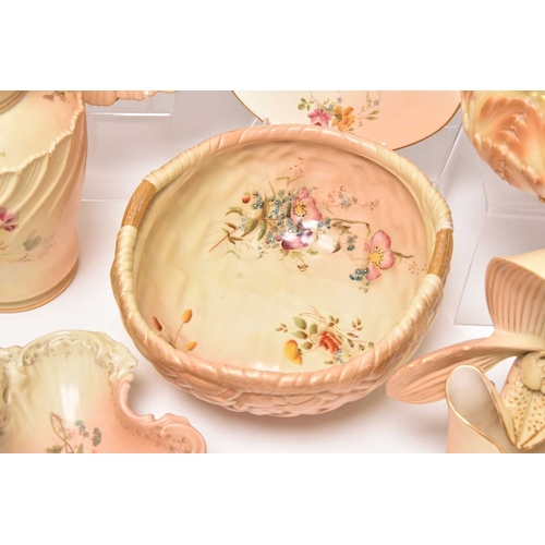 93 - A collection of Royal Worcester blush ivory, typically decorated with flowers, late 19th/early 20th ... 