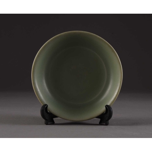 201 - A Chinese Longquan brush washer, Ming Dynasty Of shallow round form, covered in a celadon green glaz... 