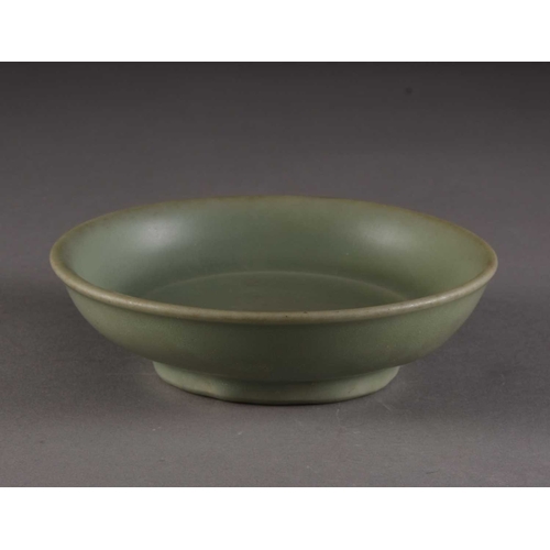 201 - A Chinese Longquan brush washer, Ming Dynasty Of shallow round form, covered in a celadon green glaz... 