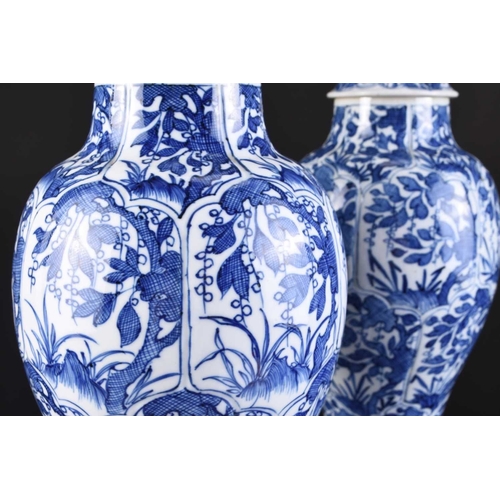 217 - A pair of Chinese transitional blue and white vases and covers, Kangxi Of ovoid form with domed cove... 