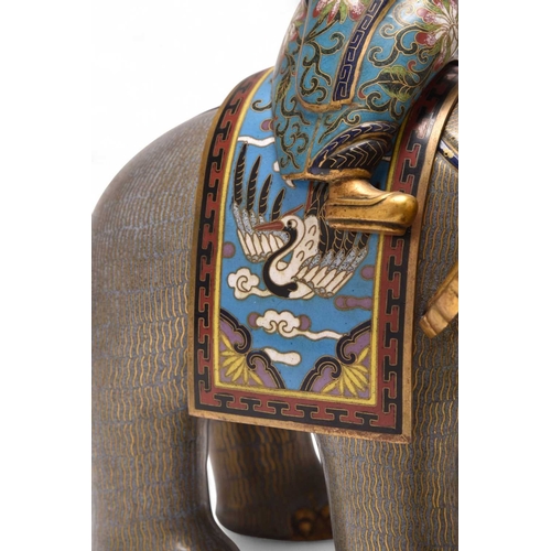 231 - A pair of Chinese cloisonne elephants and riders 19th Century The large mottled greyish lilac enamel... 