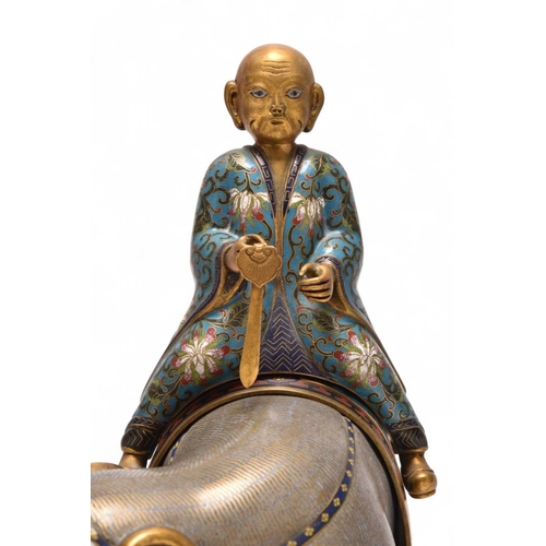 231 - A pair of Chinese cloisonne elephants and riders 19th Century The large mottled greyish lilac enamel... 