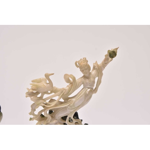 237 - A group of three Chinese jadeite figures including Moon Goddesses
20th century
Comprising a pair, mo... 