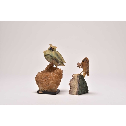 270 - Two carved hardstone models of parrots 20th century The first with an upturned foot, clutching a sma... 