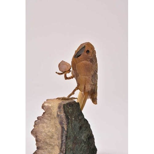 270 - Two carved hardstone models of parrots 20th century The first with an upturned foot, clutching a sma... 
