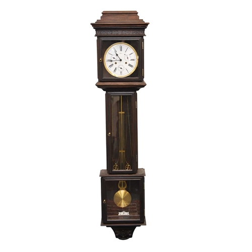 299 - A Franz Hermle weight-driven longcase form wall clock The dark stained oak case with lantern-top hoo... 