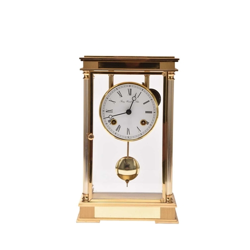 318 - A Franz Hermle & Sohn four-glass laquered brass mantel clock The 3.5 inch white dial with Roman chap... 