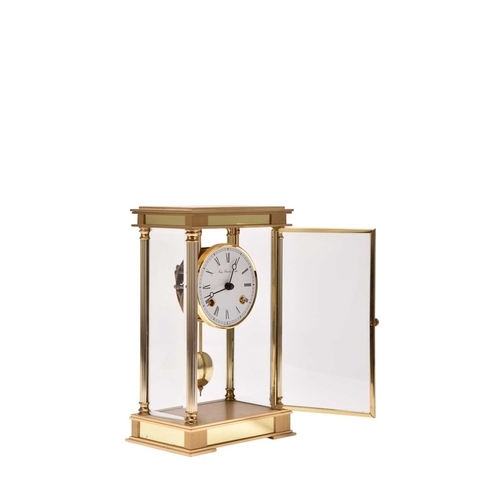318 - A Franz Hermle & Sohn four-glass laquered brass mantel clock The 3.5 inch white dial with Roman chap... 