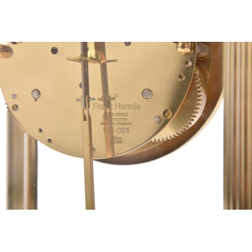 318 - A Franz Hermle & Sohn four-glass laquered brass mantel clock The 3.5 inch white dial with Roman chap... 