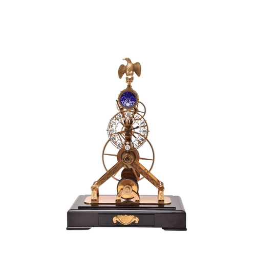 319 - A 20th century gilt brass and enamel skeleton clock The etched frame surmounted by a gilt metal eagl... 