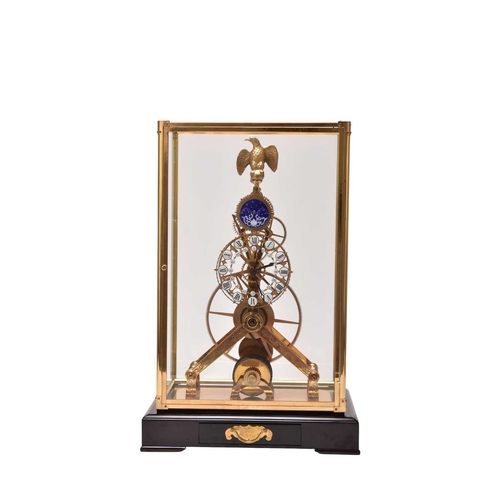 319 - A 20th century gilt brass and enamel skeleton clock The etched frame surmounted by a gilt metal eagl... 