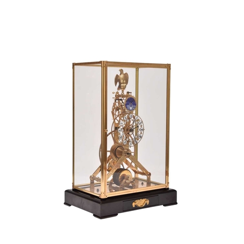 319 - A 20th century gilt brass and enamel skeleton clock The etched frame surmounted by a gilt metal eagl... 