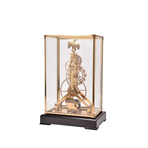 319 - A 20th century gilt brass and enamel skeleton clock The etched frame surmounted by a gilt metal eagl... 