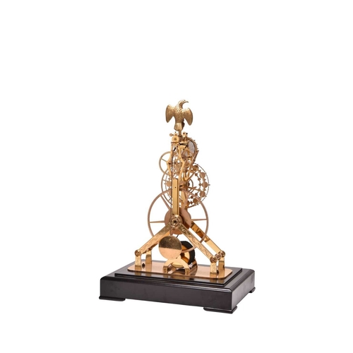 319 - A 20th century gilt brass and enamel skeleton clock The etched frame surmounted by a gilt metal eagl... 