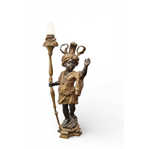 324 - A pair of reproduction bronze blackamoor torchere Modelled standing on rocky bases, wearing elaborat... 