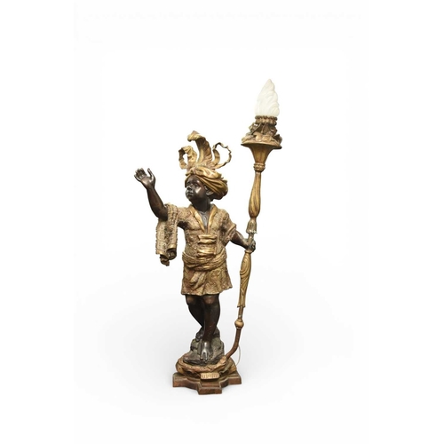 324 - A pair of reproduction bronze blackamoor torchere Modelled standing on rocky bases, wearing elaborat... 