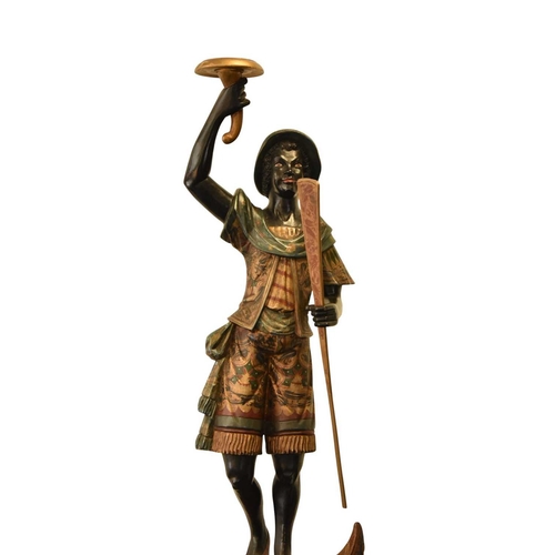 325 - A pair of reproduction painted wood blackamoor figural torchere Each modelled standing atop gondola ... 